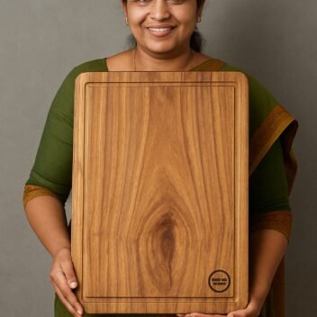"Lady holding large single block teak wood chopping board for kitchen prep"