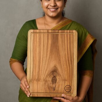 "Medium single block teak wood chopping board with smooth surface for kitchen prep"