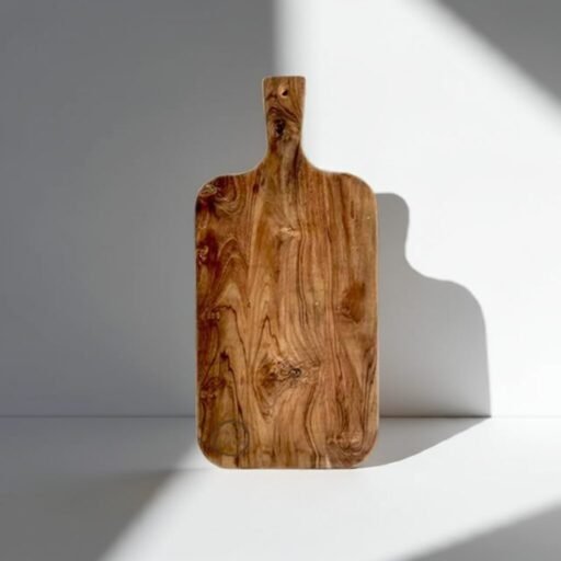 The Amra Farms Single Slab Teak Chopping Board being used to chop fresh vegetables, highlighting its spacious, knife-friendly surface and durable, eco-friendly hardwood construction.