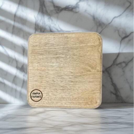 wooden herb chopping board with fresh herbs on kitchen counter