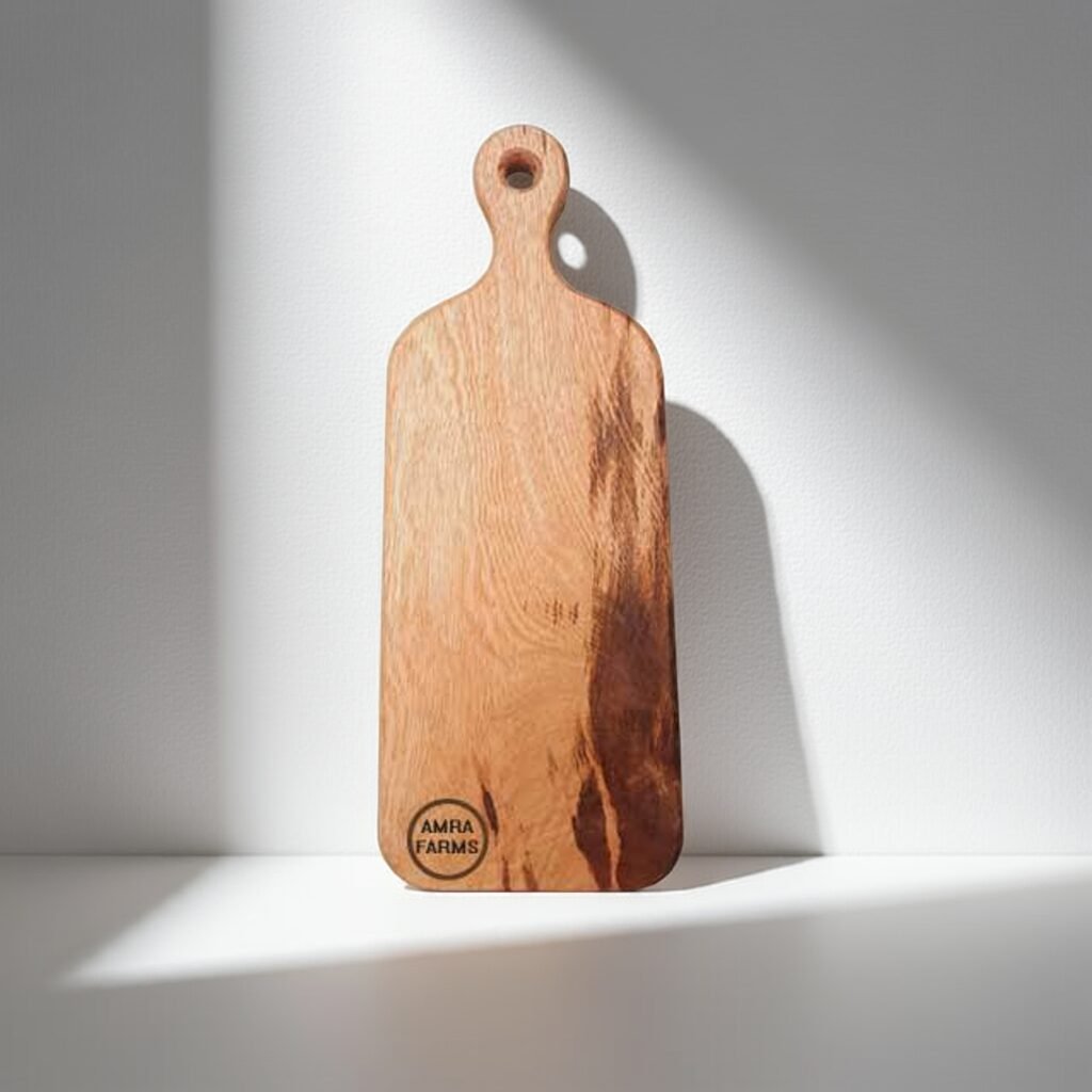 "Small wooden cutting board with handle for kitchen prep"