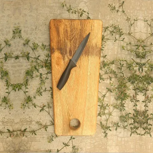 Rustic small wooden cutting board for cheese and fruits