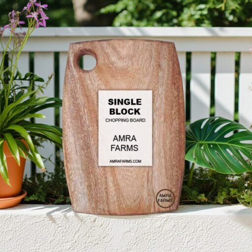 "Handcrafted mango wood serving board with ergonomic handle"