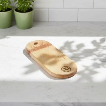 Premium mini oval mango wood cutting board by Amra Farms, single-block wooden chopping board with handle, ideal for meat, vegetables, and fruits