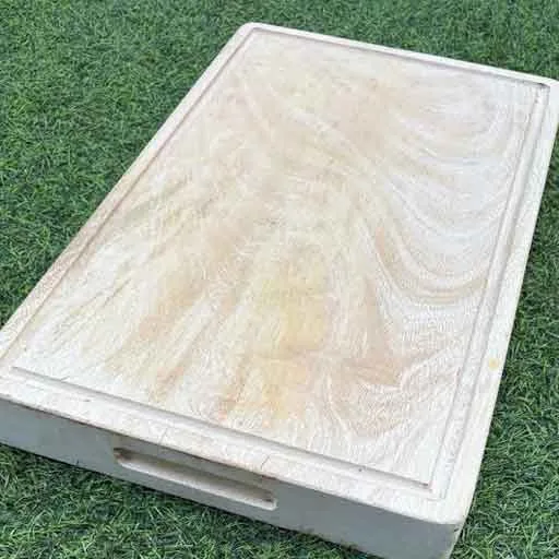 Sustainably sourced mango wood cutting board with organic lines