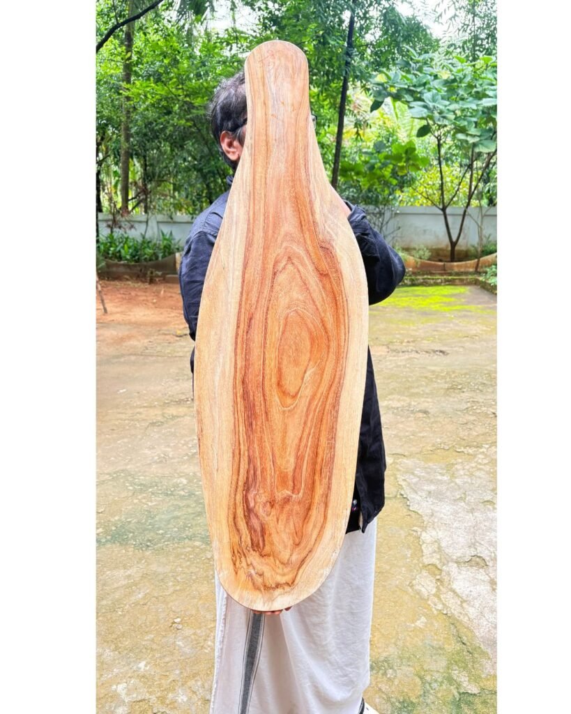 Single block live edge teak wood cutting board handcrafted by Amra Farms