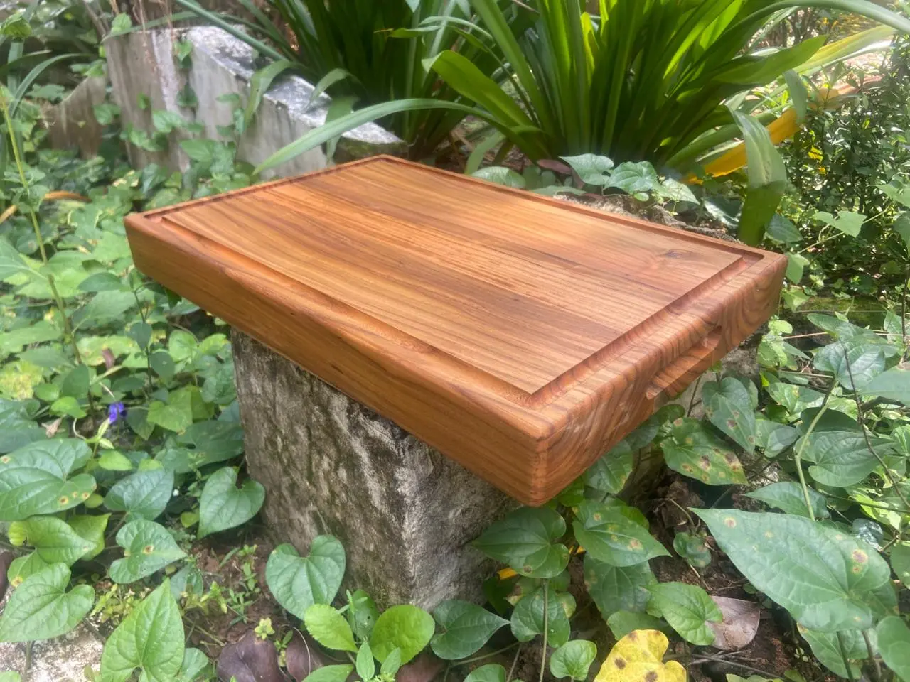 Large 2-inch thick teak wood chopping board for kitchen prep by Amra Farms